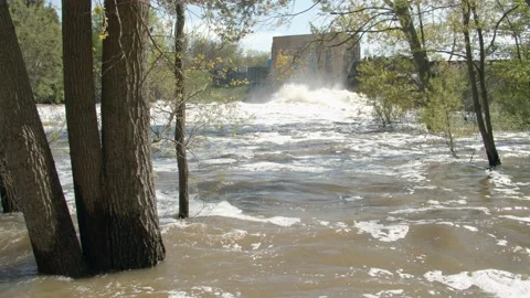 Large waves on the flooded river after a dam. 4k60p Stock Footage 132516593