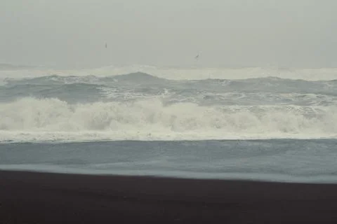 Large waves rolling on beach landscape photo Stock Photos