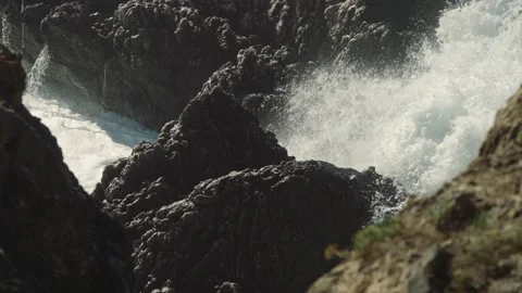 Large waves splashing through big rocks on Mediterranean coast Stock Footage 168802015