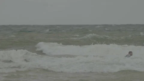 Large waves with surfers in the water Stock Footage 346282016