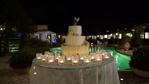 Large wedding cake against the background of the pool, slider, night Stock Footage 88851464
