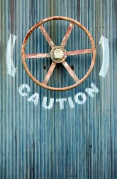 Large wheel valve with caution Stock Photos