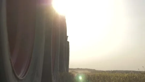 Large wheels of a moving combine on the background of the field Stock Footage 141796798