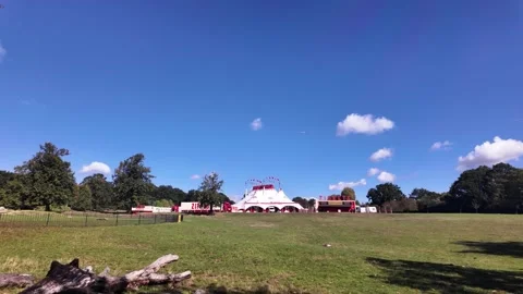 Large white and red circus tent erected in Crystal Palace Park, surrounded by Stock Footage 317165312