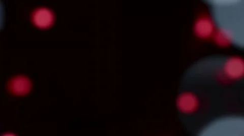 Large white and small red circles bokeh move up and down the edges of the frame Video stock 68928668