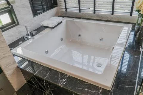 Large white bath in the bathroom, interior of the house Stock Photos