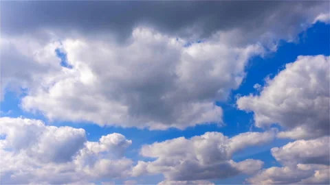 Large white blowing wind ball clouds are moving up fast, time lapse Stock Footage 197356713