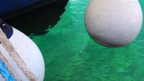 Large white buoy of the ship on the pier in the harbour Stock Footage 99534817