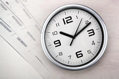 Large white clock face with calendar sheets Stock Photos