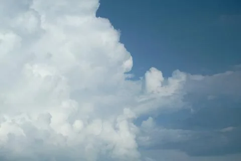 A large white cloud against a blue sky. Copy space Stock Photos