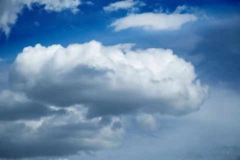 A large white cloud against a blue sky, cumulus clouds in the sky Stock Photos