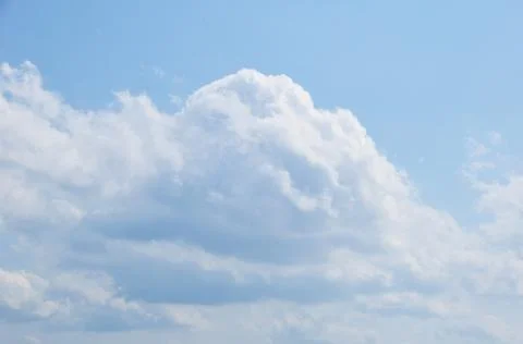 Large white cloud. Cloud against the blue sky. Stock Photos
