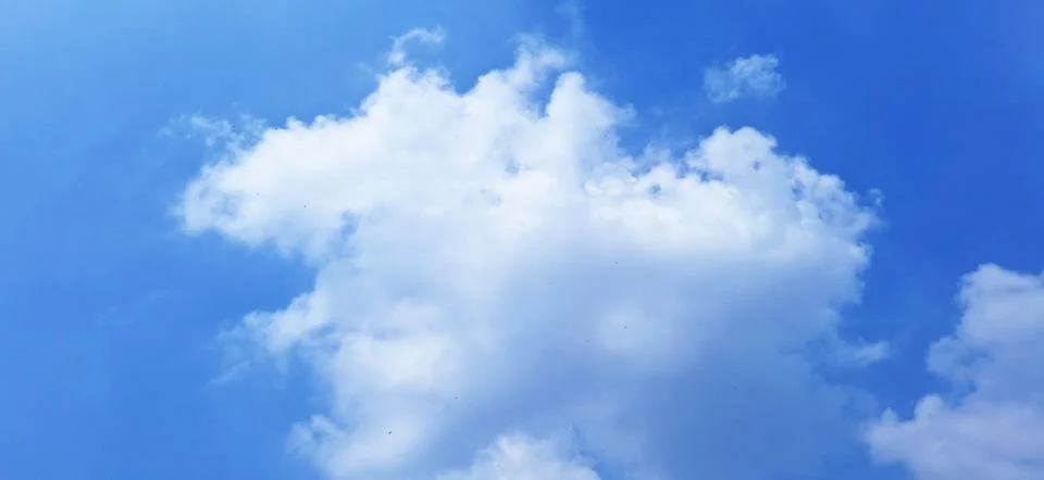 Large White Clouds in Bright Blue Sky Stock Photos