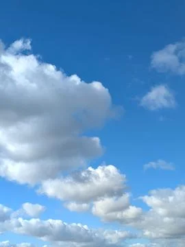 Large White Clouds in a Calm Blue Sky Stock Photos