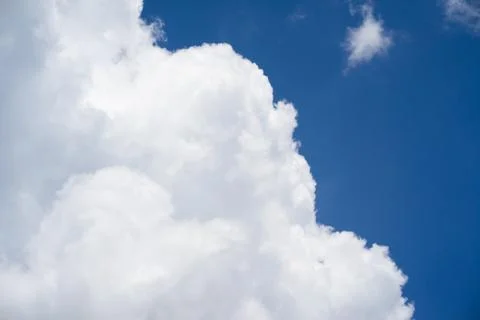 Large white clouds floating in the clear sky Stock Photos