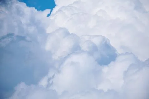 Large white clouds with thunderstorms in the blue sky Stock Photos