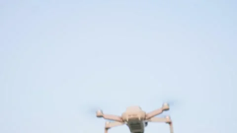 A large white copter slowly flies into the distance, background, high resolution Video stock 228684835