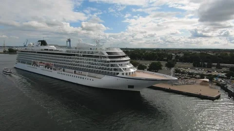 A large white cruise ship moored in the port on a sunny day Stock Footage 322810213