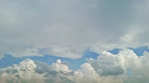Large White Cumulus Clouds Against Blue Sky Stock Footage 332355702