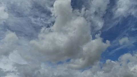 Large White Cumulus Clouds Against a Blue Sky Stock Photos