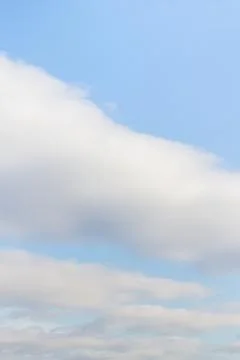 Large white Cumulus clouds on blue sky Stock Photos