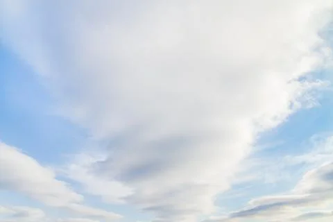 Large white Cumulus clouds on blue sky Stock Photos