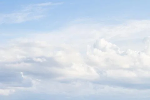 Large white Cumulus clouds on blue sky Stock Photos