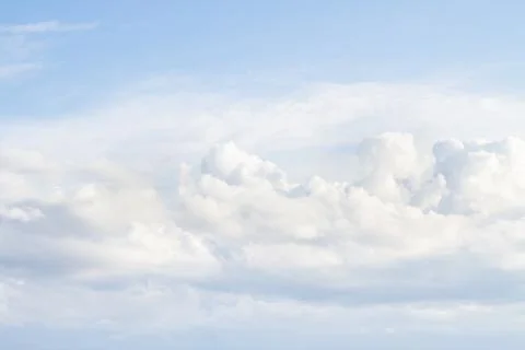 Large white Cumulus clouds on blue sky Stock Photos
