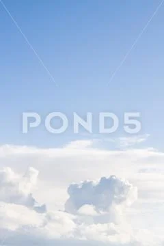 Large white Cumulus clouds on blue sky Stock Photos