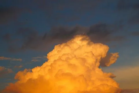 Large white cumulus clouds on a blue sky for background or ecology or nature. Stock Photos