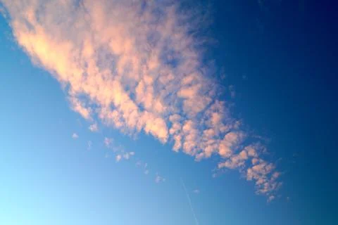 Large white cumulus clouds on a blue sky for background or ecology or nature. Stock Photos