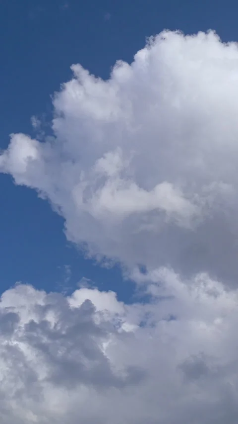 Large White Cumulus Clouds on Deep Blue Sky Time Lapse Vertical Stock-Footage 345938132