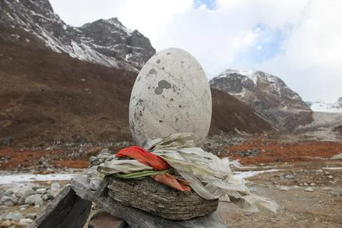 A large white egg-shaped stone in the Himalayan mountains Stock Photos