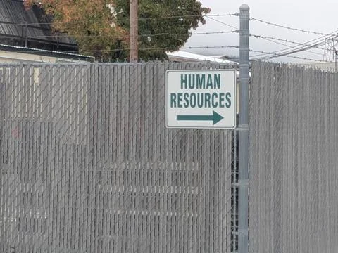 Large white “Human Resources” directional sign with green arrow Stock Photos