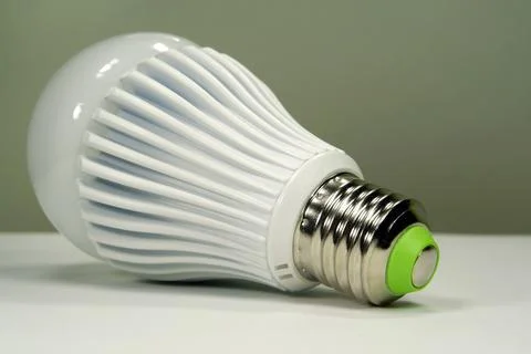 Large white LED bulb with E27 base isolated on neutral background Stockfoto's