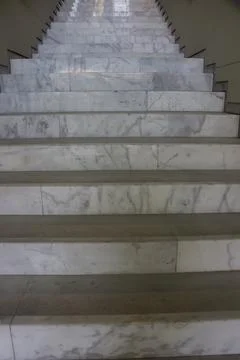 Large, white, marble steps inside a building Stock Photos
