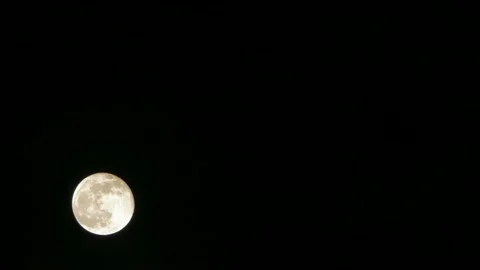 A large white moon in a black sky. Stock Footage 91060308