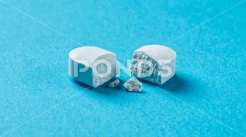 Large white pill broken into two halves on blue background ~ Premium ...