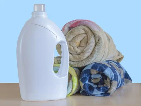 A large white plastic bottle on a blue background Stock Photos