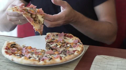 On a large white plate lies an appetizing pizza. Stock Footage 96458638