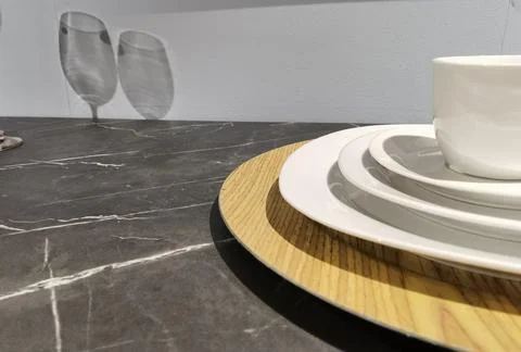 Large white serving plates stacked up Stock Photos