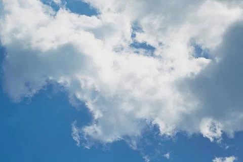 Large white shapeless cloud in the sky close-up Stock Photos
