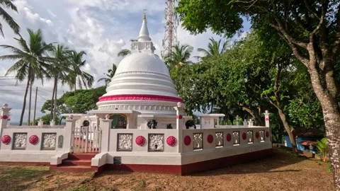 Large White Stupa Surrounded by Palms at Buddhist Temple in Sri Lanka Video stock 339943656