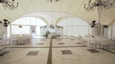 Large white wedding banquet hall laid tables and chairs Stock Footage 172192565