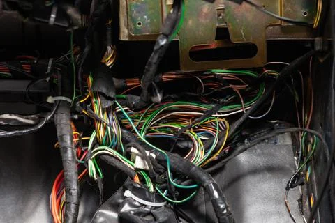 Large wide cable with multicolored red and green wires and connectors and ter Stock Photos
