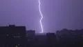 Large wide lightning bolt strikes night city, sounds of rain and thunder 4k or 4k+ Resolution