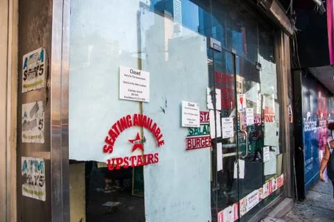 Large widow storefront with signs Stock Photos