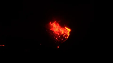 Large wildfire flames in mountain ridge at night Stock Footage 80357846