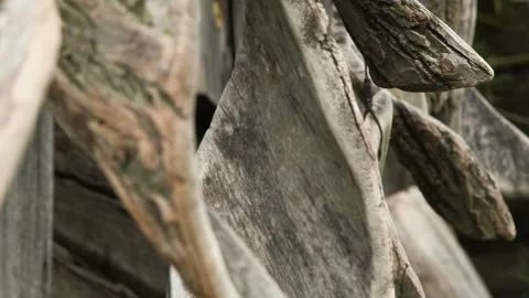 Large wind chimes made of tree bark slowly sway in the wind Stock Footage 248847071