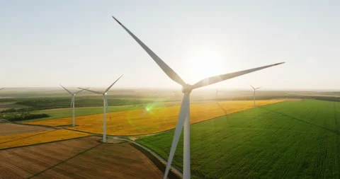Large wind turbine rotating blades on blue sky aerial view Stock Footage 301892883